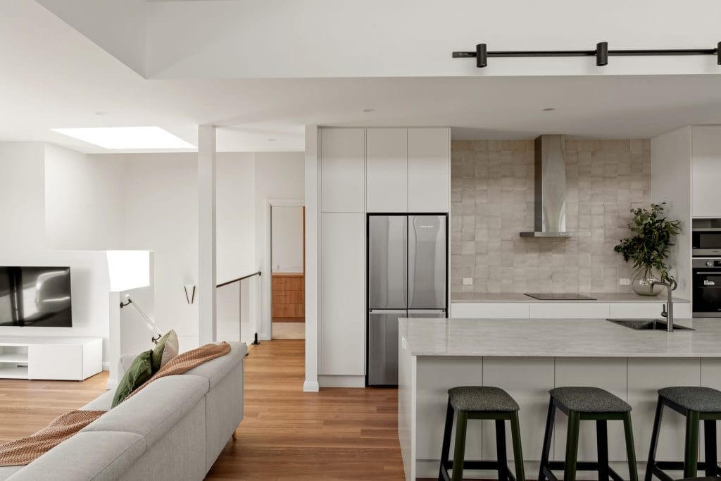 Wide view of an open plan living area by YourBuild Construct