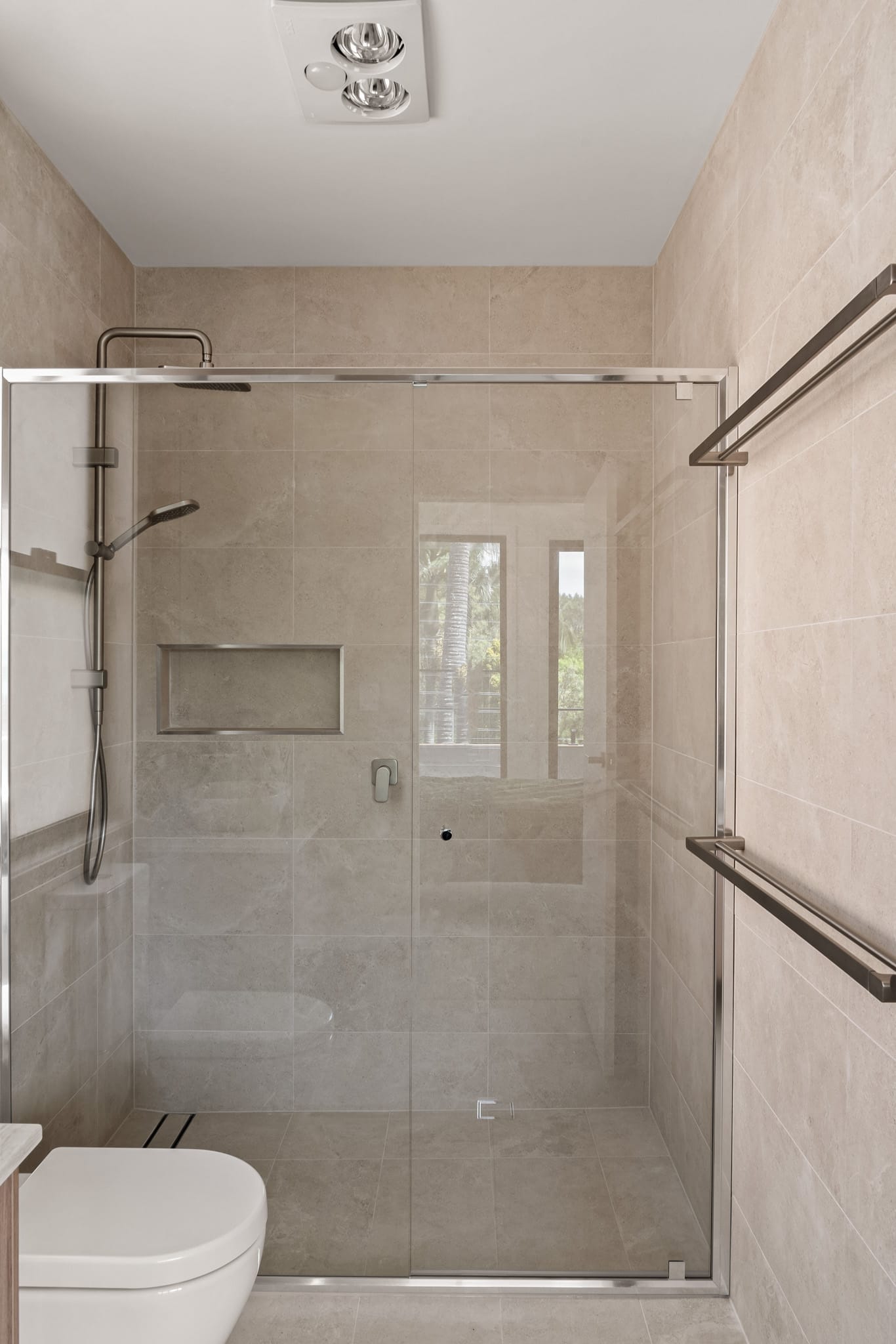 A contemporary shower recess with semi framed shower screen