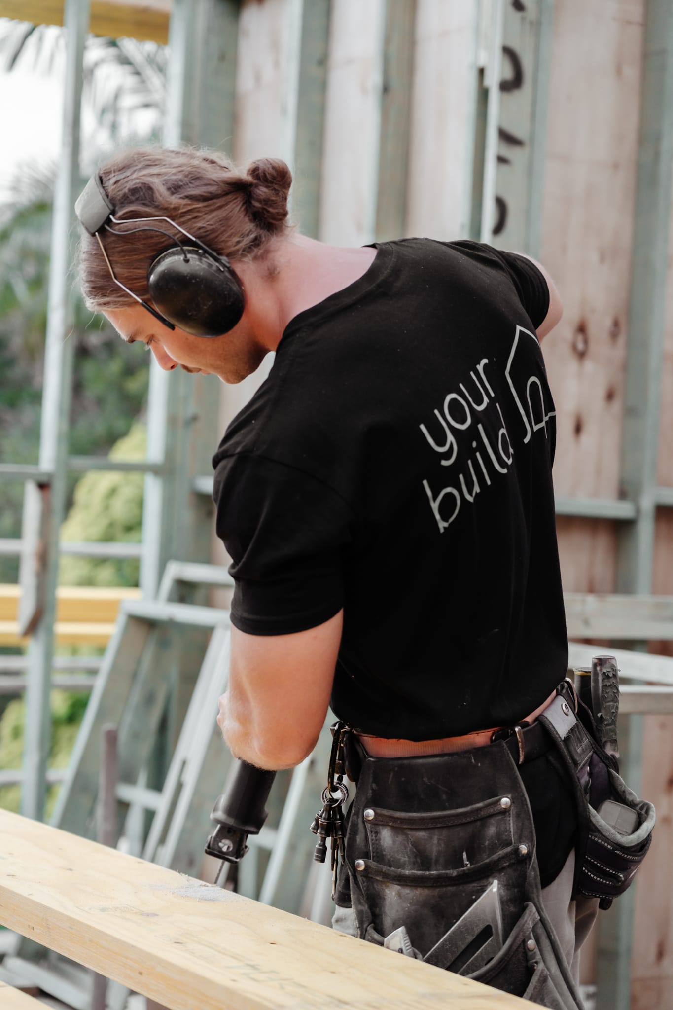 A team member from YourBuild Construct working onsite.